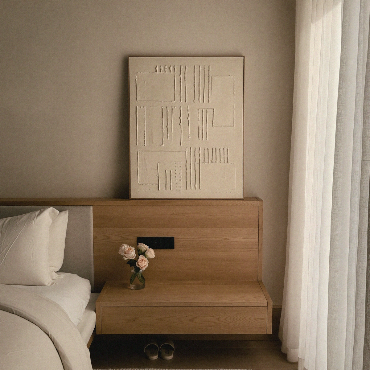 Sculptural DORSA nightstand beside a luxury upholstered bed